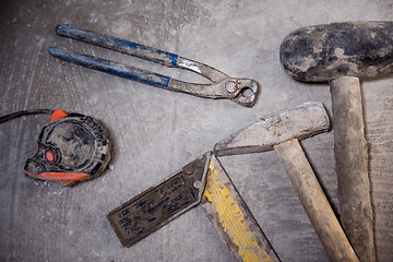 Image showing set of hand working tools on concrete background