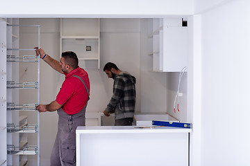 Image showing workers installing a new kitchen