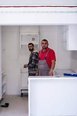 Image showing workers installing a new kitchen