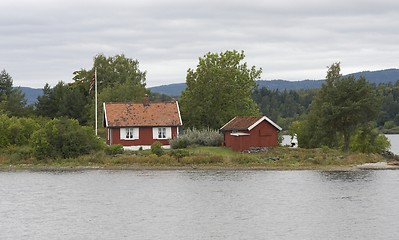 Image showing Small cottage on a small island