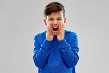 Image showing angry boy in blue hoodie shouting