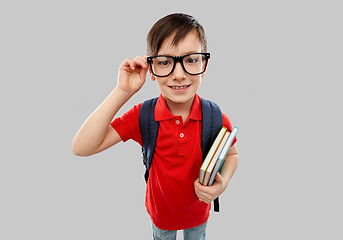 Image showing smiling student boy in glasses with books and bag