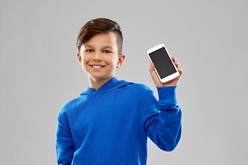 Image showing smiling boy in blue hoodie showing smartphone