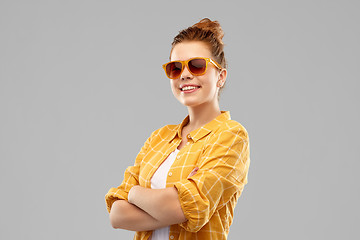 Image showing smiling red haired teenage girl in sunglasses