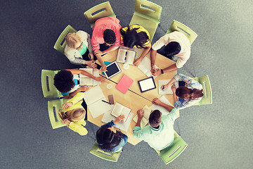 Image showing group of students with tablet pc at school library