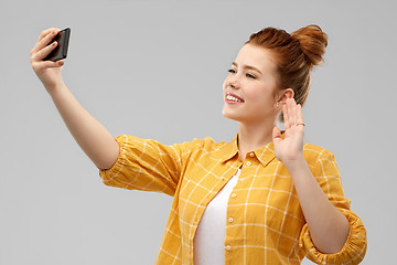 Image showing redhead teenage girl taking selfie by smartphone