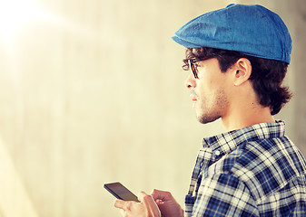 Image showing close up of man texting message on smartphone