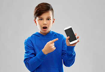 Image showing shocked boy in blue hoodie showing smartphone