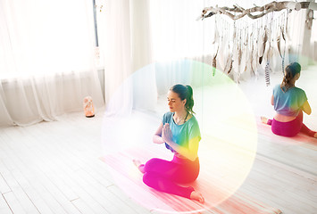 Image showing woman meditating at yoga studio