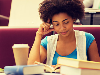 Image showing student girl with books and coffee on lecture