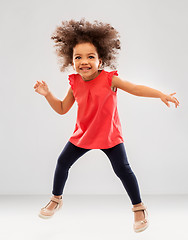 Image showing happy little african american girl jumping