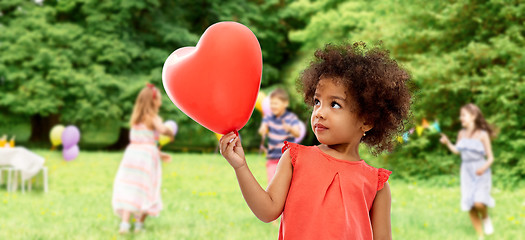 Image showing african american girl with heart shaped balloon