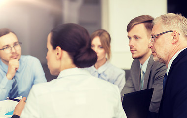 Image showing smiling business people meeting in office