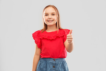 Image showing beautiful smiling girl showing thumbs up