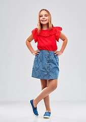 Image showing beautiful smiling girl in red shirt and skirt