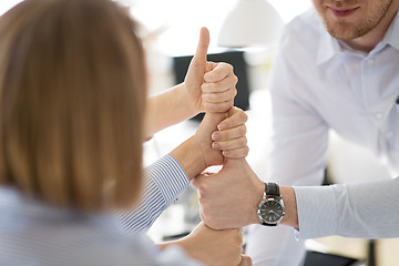 Image showing group of business team making thumbs up gesture