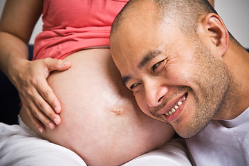 Image showing Happy expecting asian couple