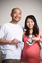 Image showing Happy expecting asian couple