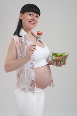 Image showing Pregnant woman and healthy food