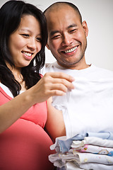 Image showing Happy expecting asian couple