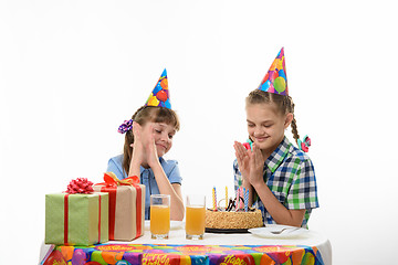 Image showing Children enjoy a delicious birthday cake