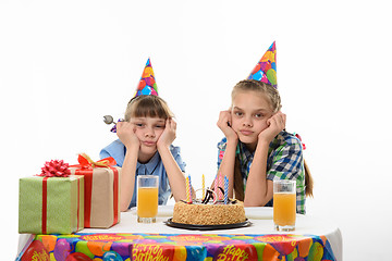 Image showing Children are waiting for the cake to be eaten at the holiday table