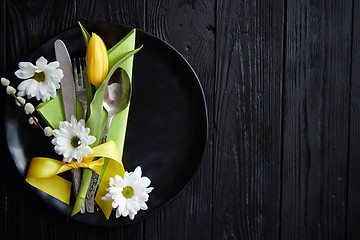 Image showing Easter spring table dishware composition with yellow tulip flower