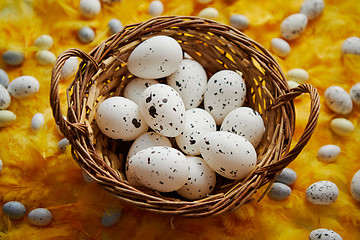 Image showing Easter holidays concept. White dotted chicken Eggs in the wicker