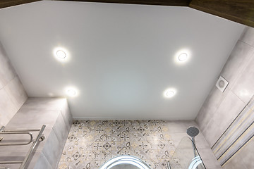 Image showing Stretched ceiling in a modern bathroom after renovation