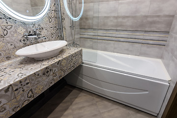 Image showing The interior of a stylish compact bathroom