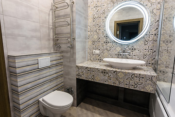 Image showing The interior of a modern bathroom combined with a toilet