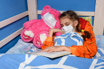 Image showing Sick girl in medical mask fell asleep in bed
