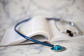 Image showing Stethoscope and book