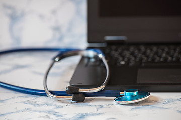 Image showing Stethoscope and notebook