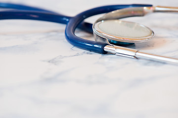 Image showing Medical stethoscope or phonendoscope over light blue background