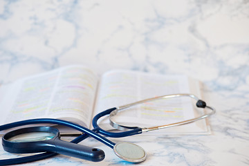 Image showing Stethoscope and book