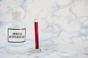 Image showing Ethanol in a bottle and blood analysis