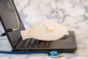 Image showing Stethoscope and notebook