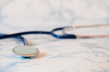 Image showing Medical stethoscope or phonendoscope over light blue background