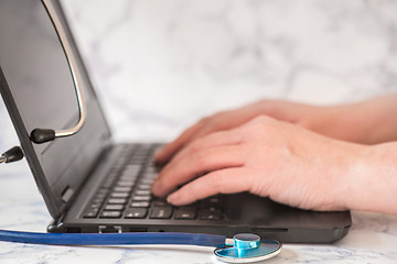 Image showing Stethoscope and notebook