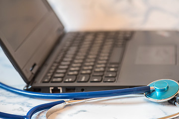 Image showing Stethoscope and notebook