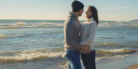 Image showing Couple having fun on beautiful autumn day at beach