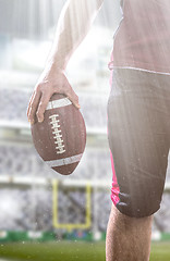 Image showing closeup American Football Player isolated on big modern stadium