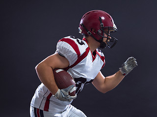 Image showing American football Player running with the ball