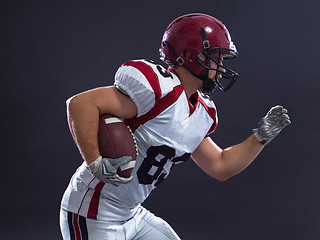 Image showing American football Player running with the ball