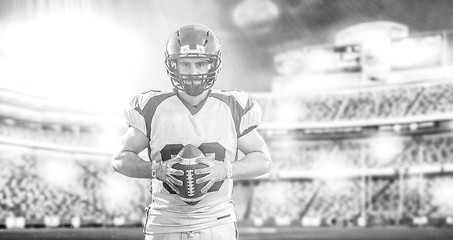 Image showing American Football Player isolated on big modern stadium field