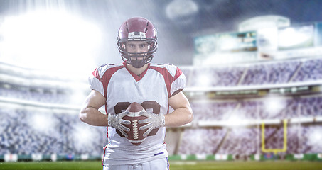 Image showing American Football Player isolated on big modern stadium field