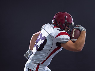 Image showing American football Player running with the ball