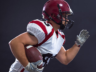 Image showing American football Player running with the ball