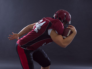 Image showing American football Player running with the ball